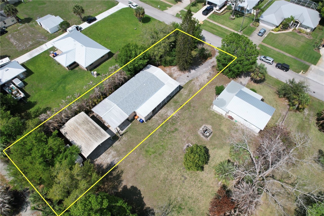 5519 95th Street Sebastian, FL 32958 - Photo 14 of 35 an aerial view of a house with a garden