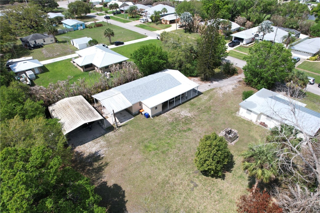 5519 95th Street Sebastian, FL 32958 - Photo 15 of 35 an aerial view of a house with yard and mountain view in back