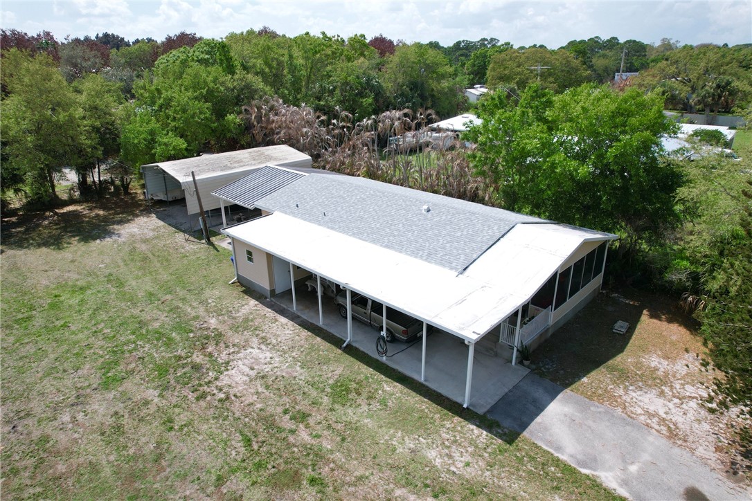 5519 95th Street Sebastian, FL 32958 - Photo 16 of 35 a view of a dinning table and chairs in the roof deck