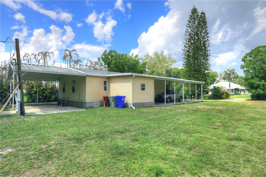 5519 95th Street Sebastian, FL 32958 - Photo 18 of 35 a view of a house with backyard and garden