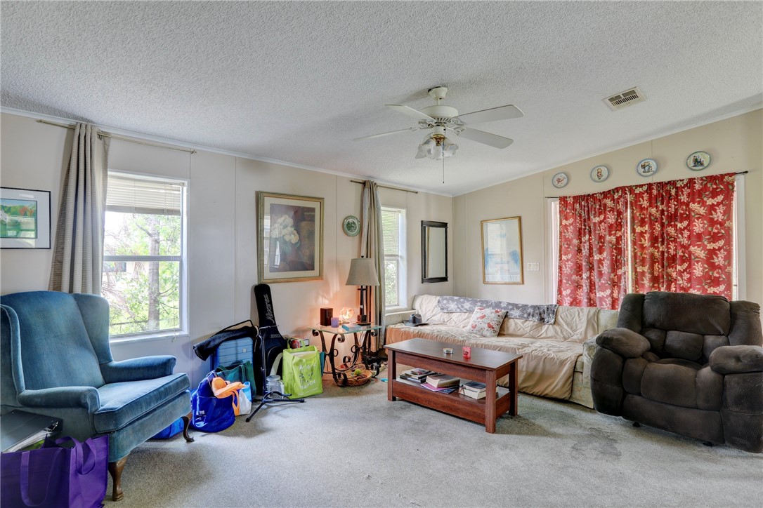 5519 95th Street Sebastian, FL 32958 - Photo 21 of 35 a bedroom with furniture and a large window
