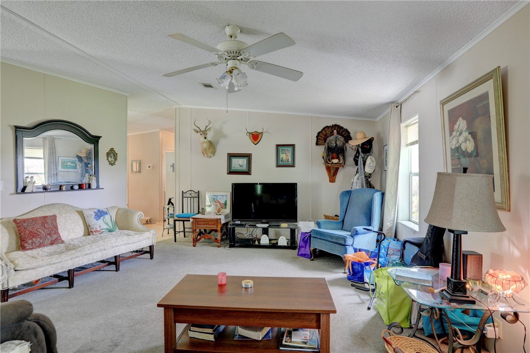 5519 95th Street Sebastian, FL 32958 - Photo 22 of 35 a living room with furniture and a flat screen tv