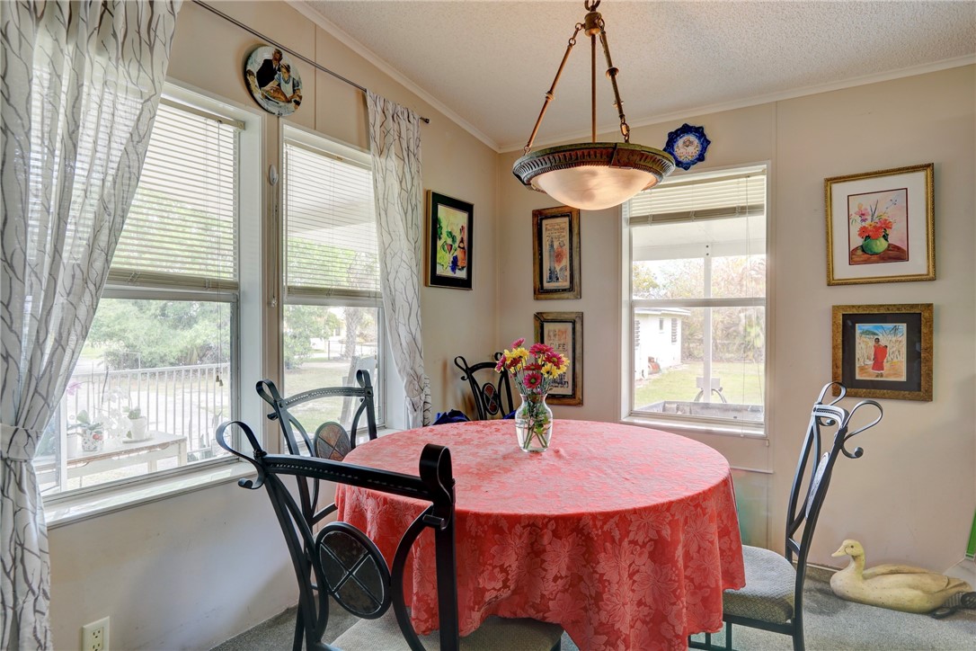 5519 95th Street Sebastian, FL 32958 - Photo 24 of 35 a view of a dining room with furniture window and outside view