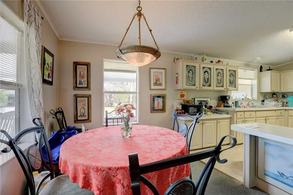 a kitchen with cabinets and window