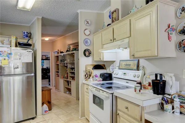 a kitchen with cabinets a window and sink