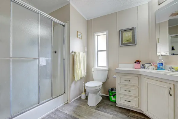 a bedroom with a bed chair and window