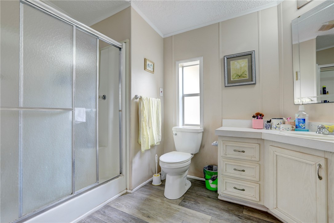 5519 95th Street Sebastian, FL 32958 - Photo 31 of 35 a bathroom with a sink toilet and shower