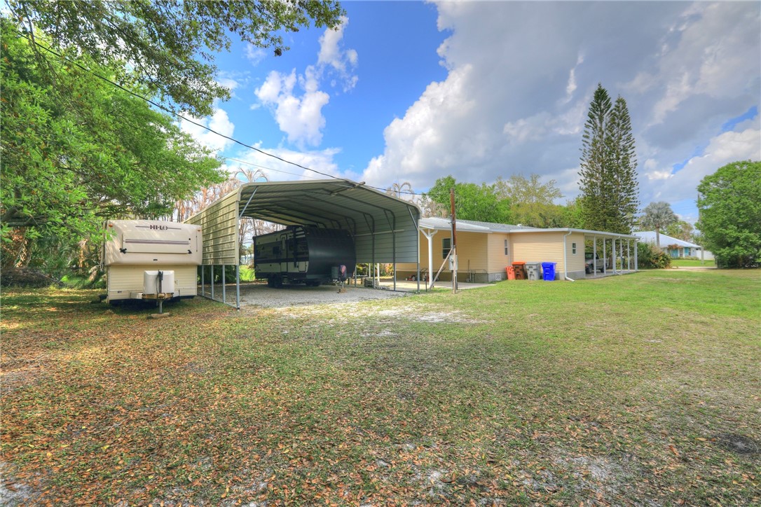 5519 95th Street Sebastian, FL 32958 - Photo 5 of 35 a view of a house with backyard and sitting area