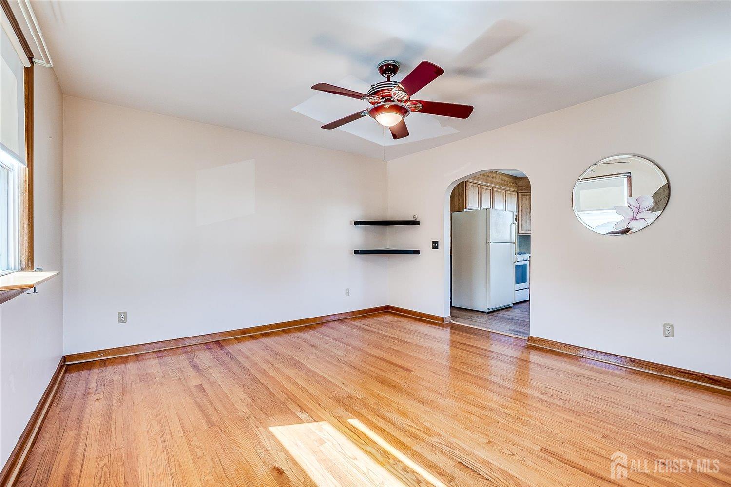 92 Lake View Boulevard Edison, NJ 08817 - Photo 11 of 39 a view of empty room with wooden floor and fan