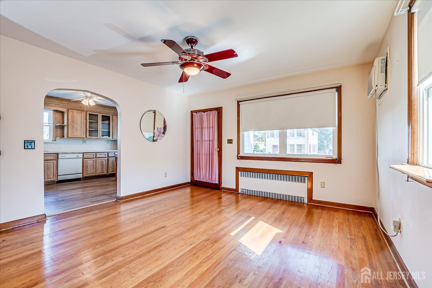 92 Lake View Boulevard Edison, NJ 08817 - Photo 12 of 39 a view of an empty room with a window and wooden floor