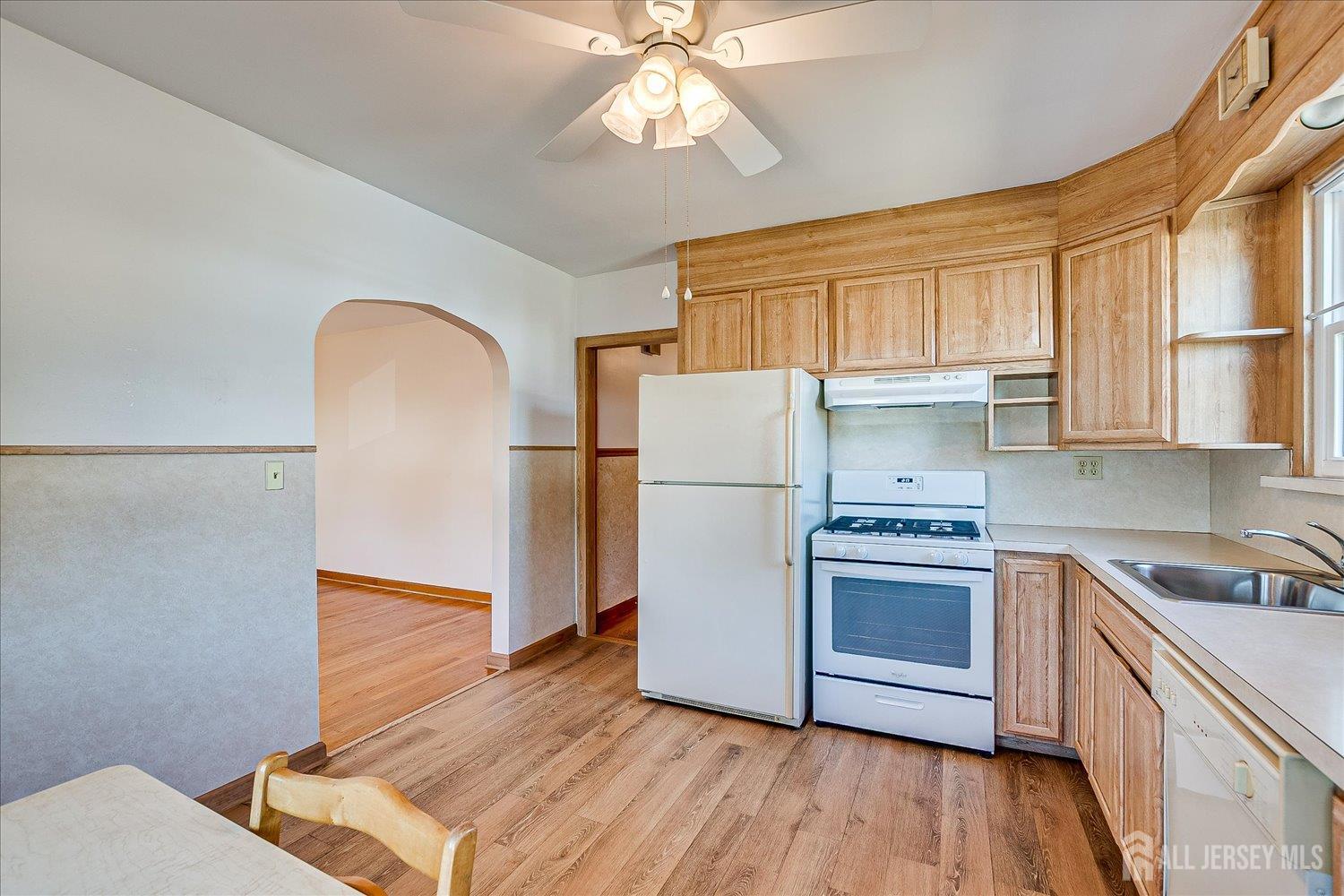 92 Lake View Boulevard Edison, NJ 08817 - Photo 16 of 39 a kitchen with a sink cabinets stainless steel appliances and a window