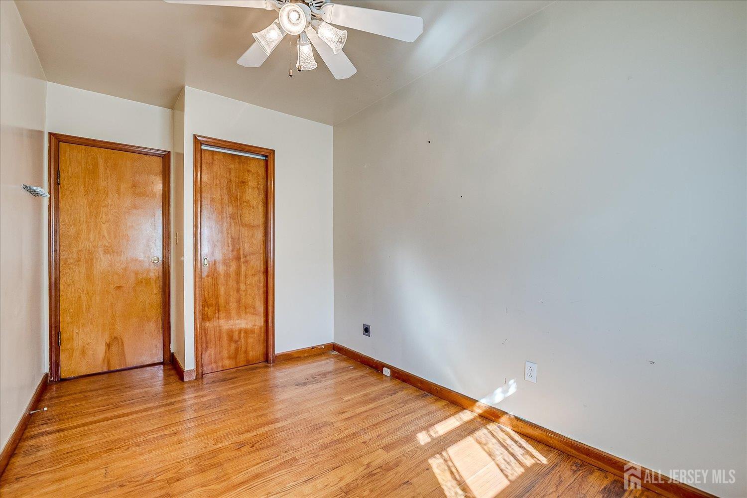 92 Lake View Boulevard Edison, NJ 08817 - Photo 23 of 39 wooden floor in an empty room with a window