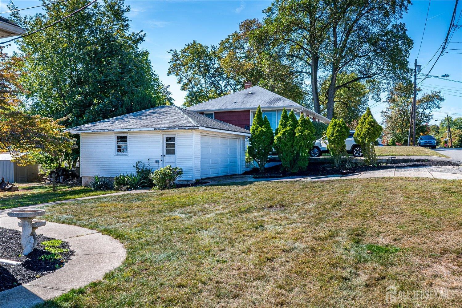 92 Lake View Boulevard Edison, NJ 08817 - Photo 26 of 39 a front view of a house with a garden