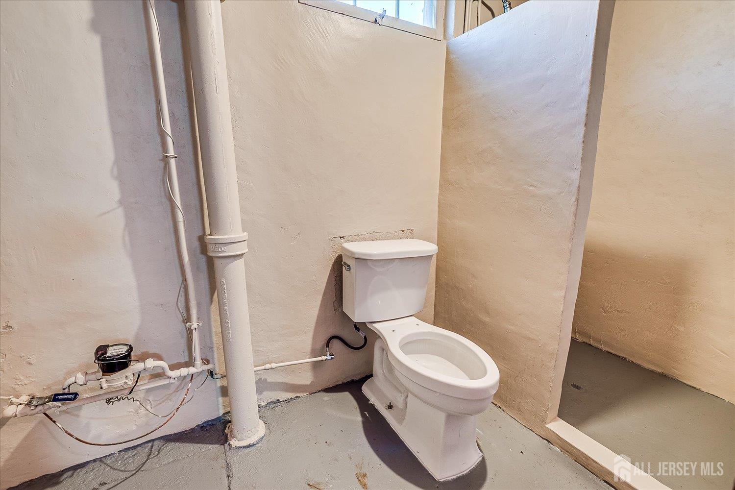 92 Lake View Boulevard Edison, NJ 08817 - Photo 31 of 39 a white toilet sitting next to a bathroom sink