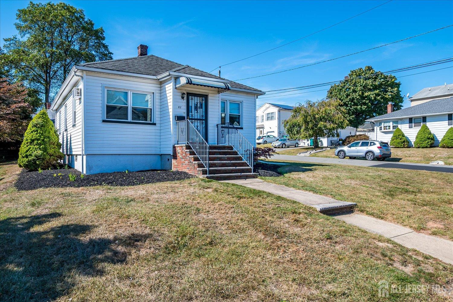 92 Lake View Boulevard Edison, NJ 08817 - Photo 5 of 39 a front view of a house with a yard