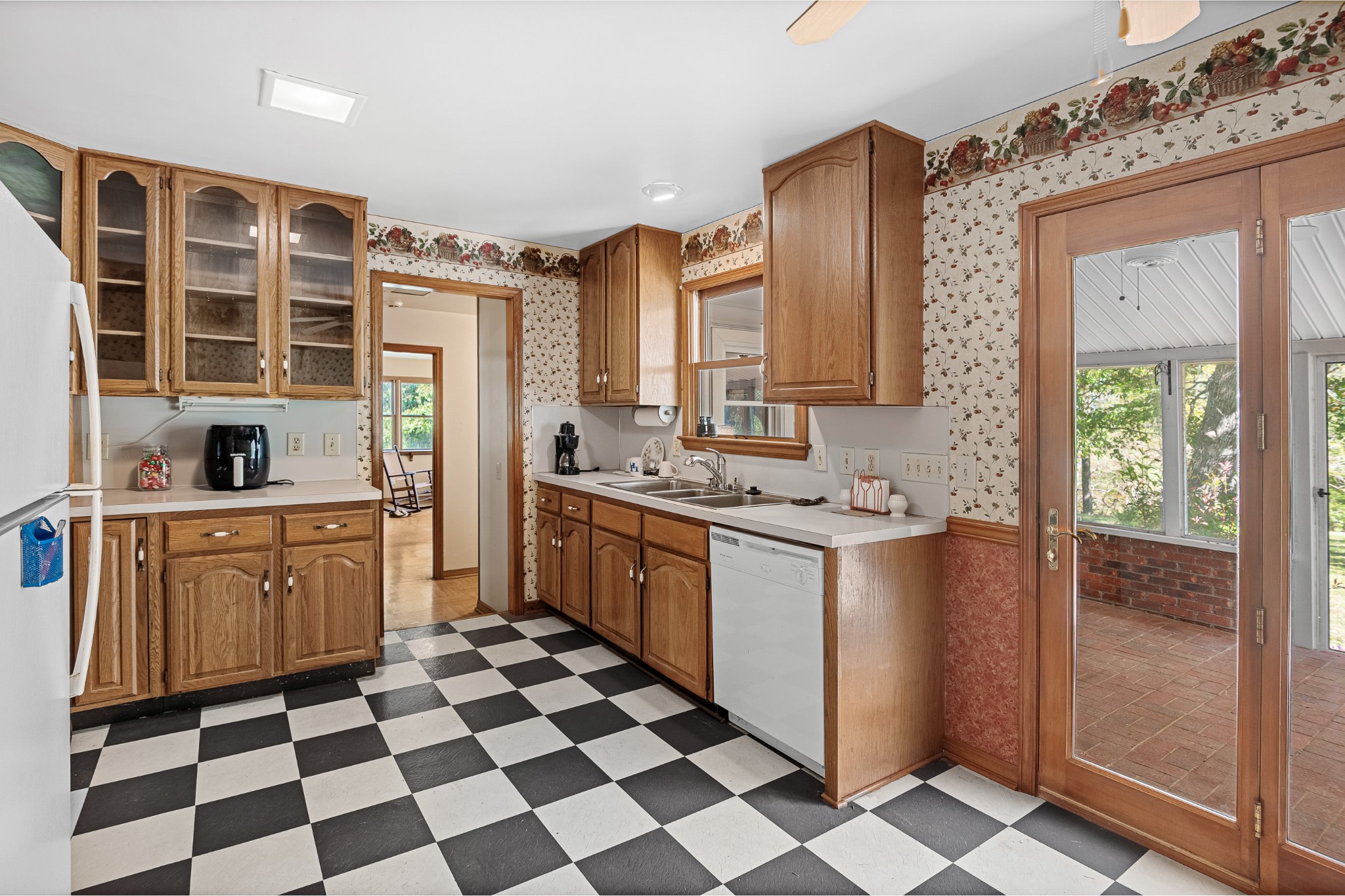 2159 Verona Caney Road Lewisburg, TN 37091 - Photo 13 of 41 a kitchen with a checkered floor and white cabinets