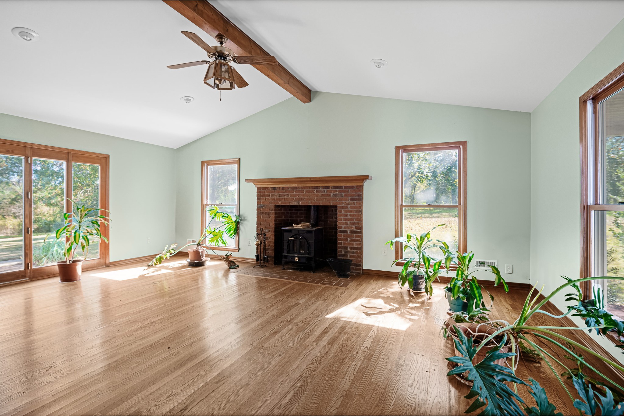 2159 Verona Caney Road Lewisburg, TN 37091 - Photo 8 of 41 a view of an empty room with wooden floor and a fireplace