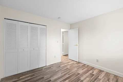 a view of a livingroom with wooden floor