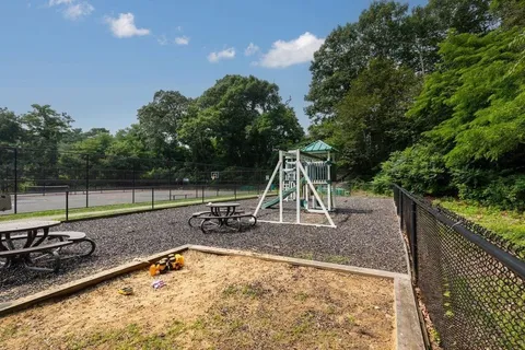 a view of a park with a slide