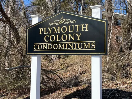 a sign broad on the side of the tree