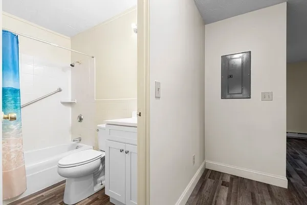 a bathroom with a toilet a sink and a bathtub