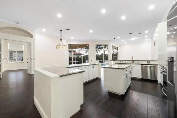 a view of kitchen with cabinets and wooden floor