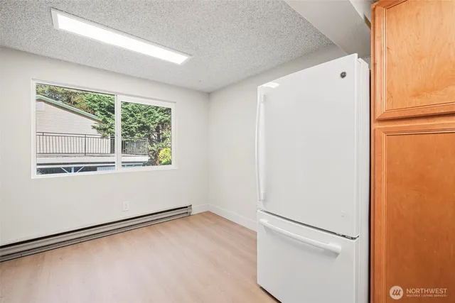 a view of a kitchen with a white refrigerator