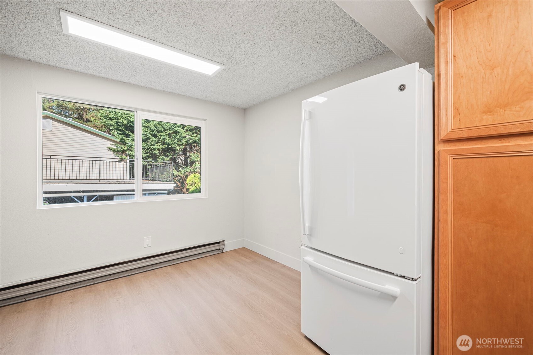 210 Southwest Clark Street, Unit A202 Issaquah, WA 98027 - Photo 12 of 28 a view of a kitchen with a white refrigerator