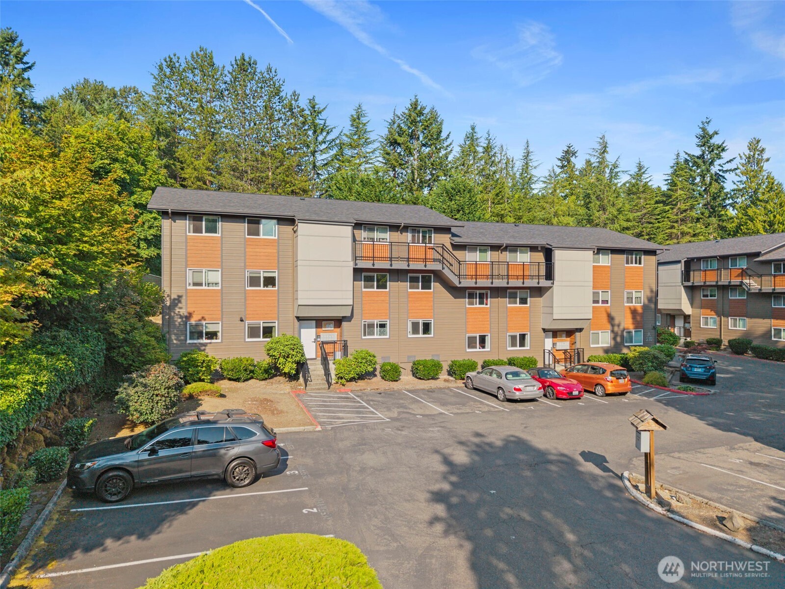 210 Southwest Clark Street, Unit A202 Issaquah, WA 98027 - Photo 26 of 28 a front view of a house with garden