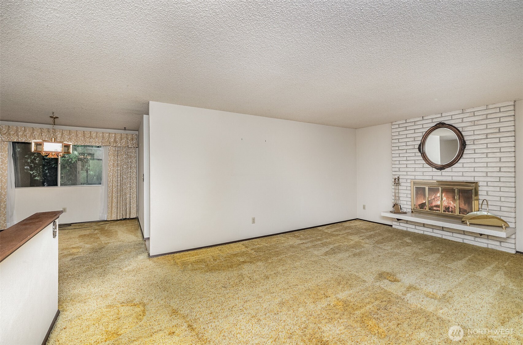 401 South 26th Street Renton, WA 98055 - Photo 5 of 40 a view of an empty room with a fireplace and a window