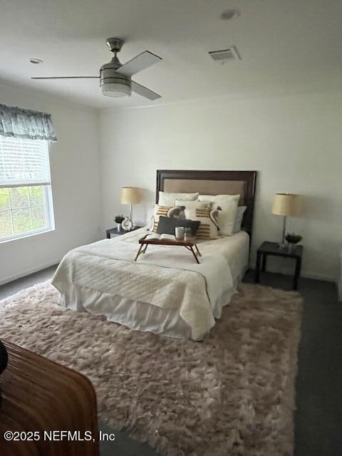 540316 Lem Turner Road Callahan, FL 32011 - Photo 12 of 25 a large bed sitting in a bedroom next to a window