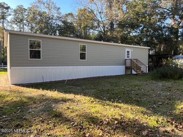 540316 Lem Turner Road Callahan, FL 32011 - Photo 21 of 25 a view of a house with a yard