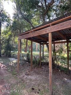 540316 Lem Turner Road Callahan, FL 32011 - Photo 22 of 25 a backyard of a house with large trees and plants