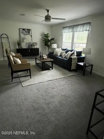 a large bed sitting in a bedroom next to a window