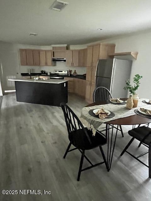 540316 Lem Turner Road Callahan, FL 32011 - Photo 7 of 25 a kitchen with kitchen island a appliances dining table and chairs