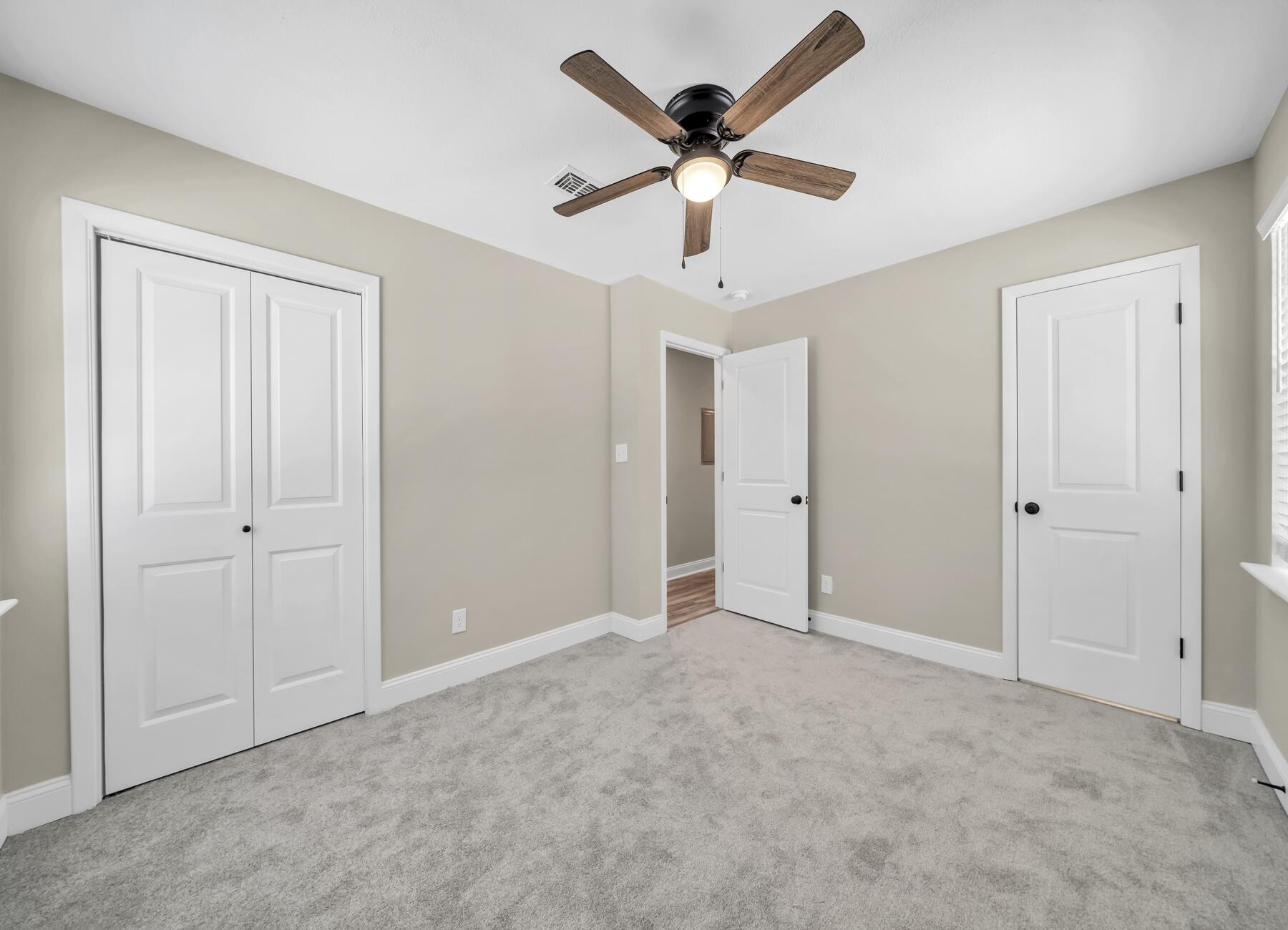 3102 Barnhill Road Crestview, FL 32539 - Photo 33 of 44 a view of an empty room with a ceiling fan