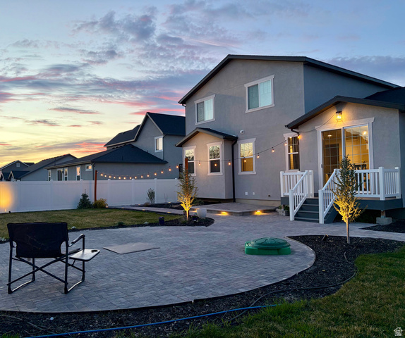 3359 Eurasian Crane Road Clinton, UT 84015 - Photo 65 of 71 Back of house featuring a patio, a fenced backyard, stucco siding, and a wooden deck