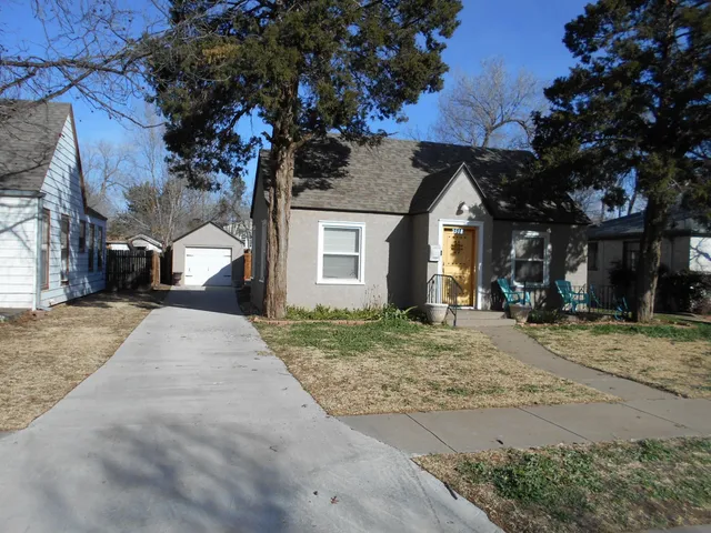 a dining room with furniture and a window