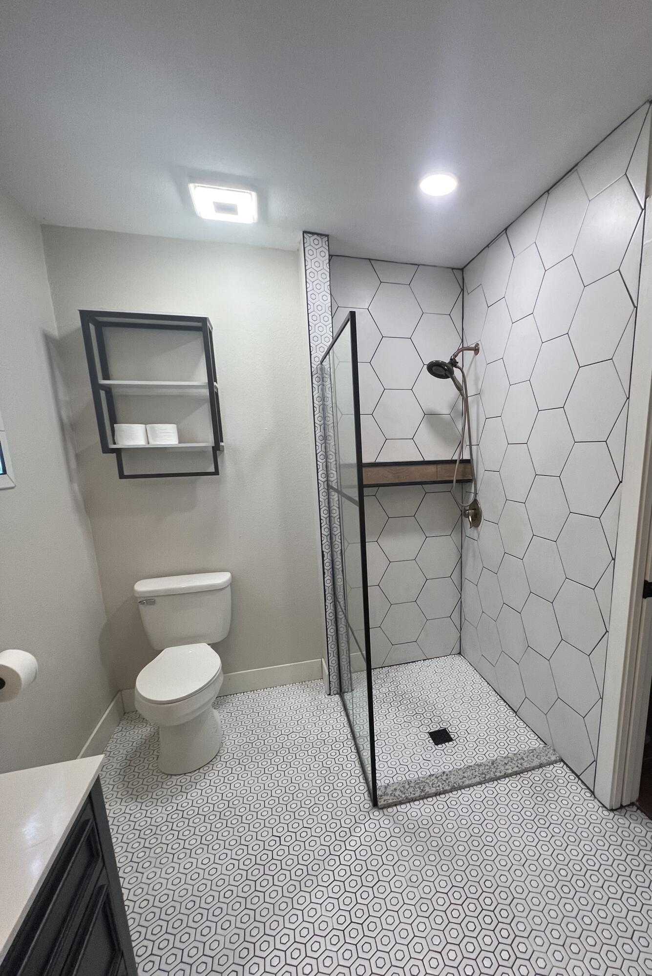 2518 25th Street Lubbock, TX 79410 - Photo 39 of 39 a bathroom with a shower a toilet and a sink