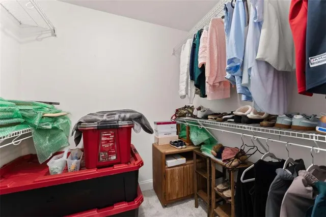 a utility room with lots of different colored cloths