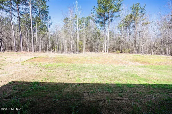 a view of an ocean yard and trees