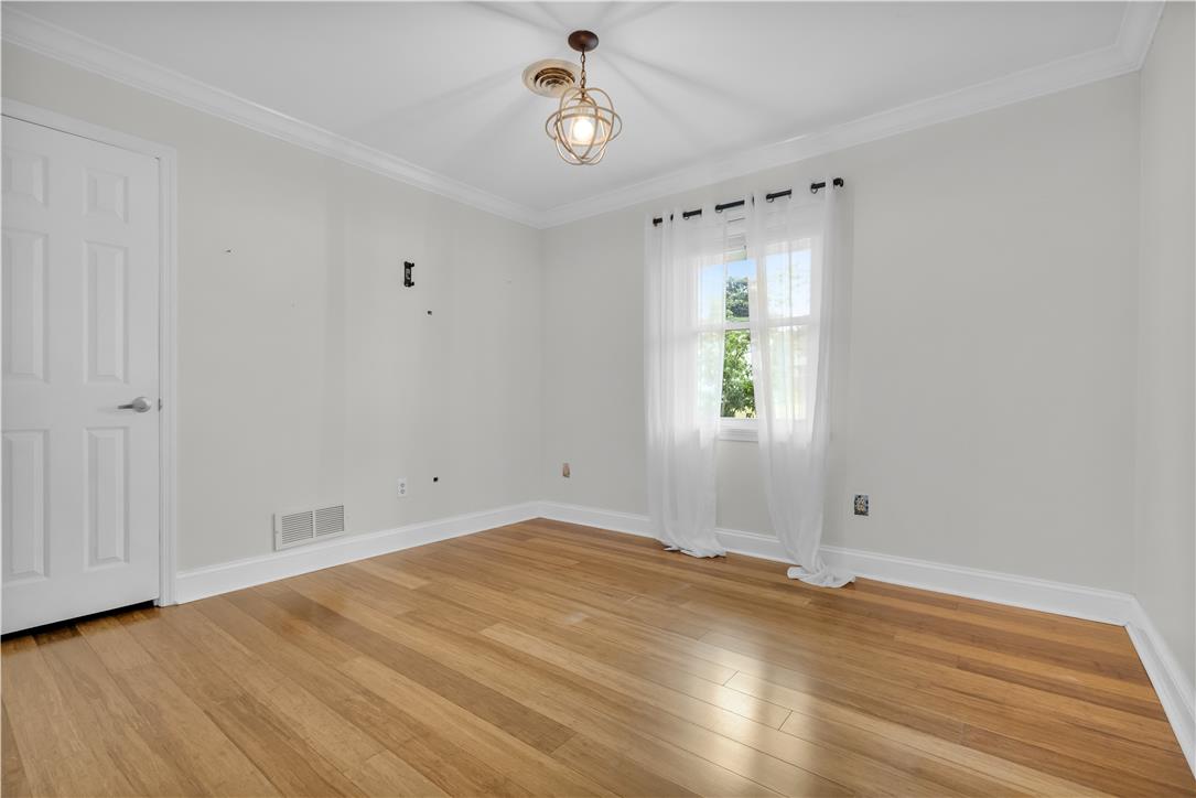 3396 Darien Road Bethlehem, PA 18020 - Photo 23 of 44 Hardwood floors and a bright window create an inviting atmosphere in this versatile room.