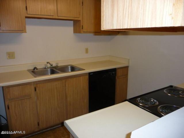 3511 East Baseline Road, Unit 1012 Phoenix, AZ 85042 - Photo 3 of 4 a kitchen with a sink and cabinets