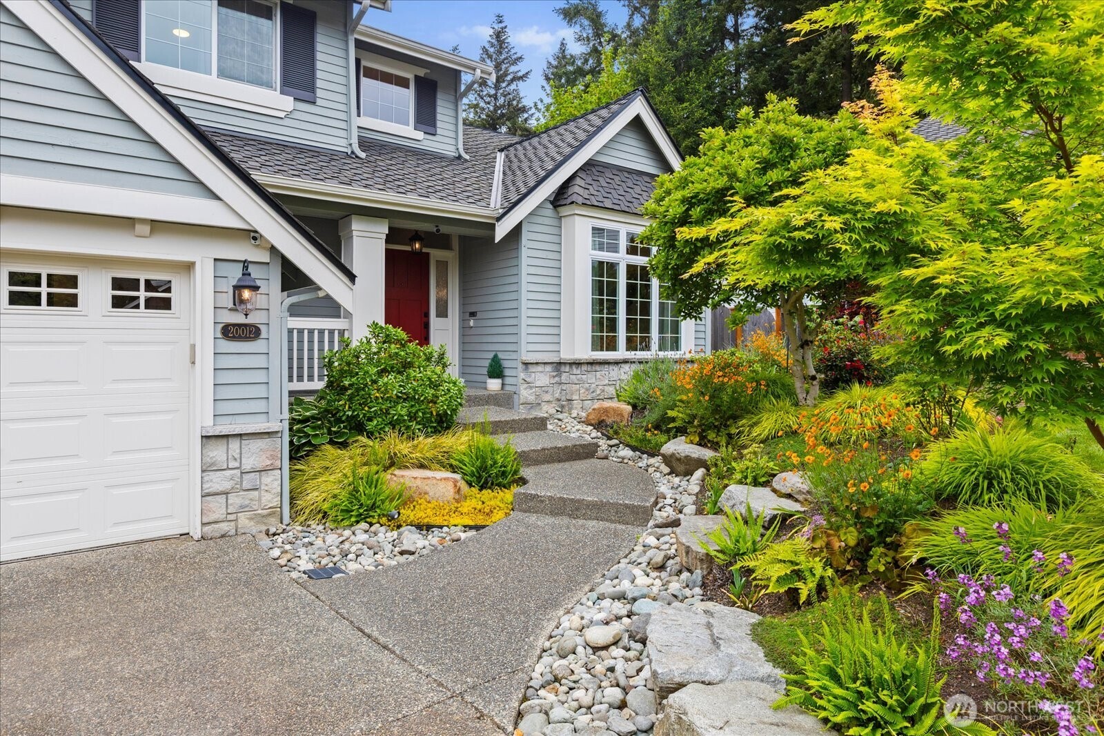 20012 27th Drive Southeast Bothell, WA 98012 - Photo 1 of 39 a front view of a house with a yard