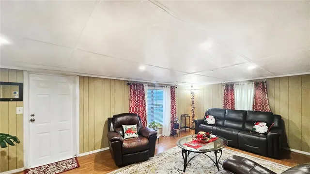 a kitchen with a refrigerator and a stove top oven