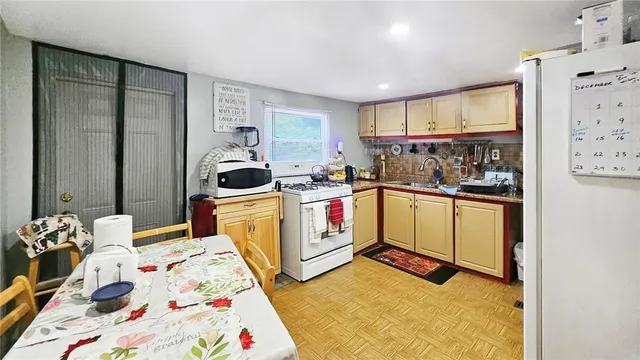 a bedroom with a bed and a tv