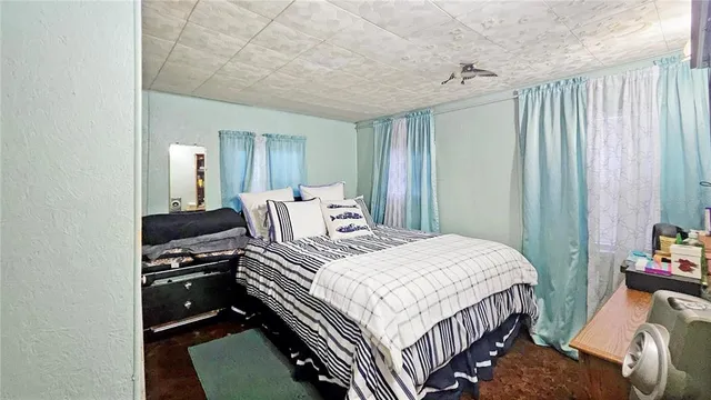 a bathroom with a toilet and a shower curtain