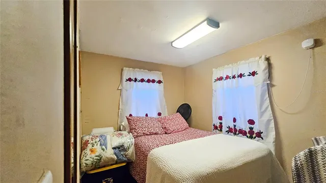 a view of a house with backyard porch and sitting area