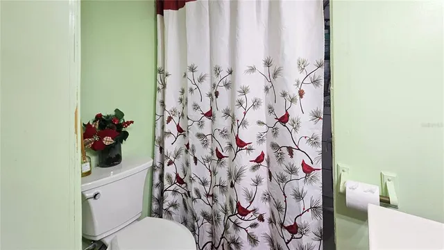 a view of a patio with table and chairs potted plants