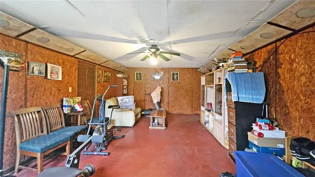 a view of a house with backyard and a tree